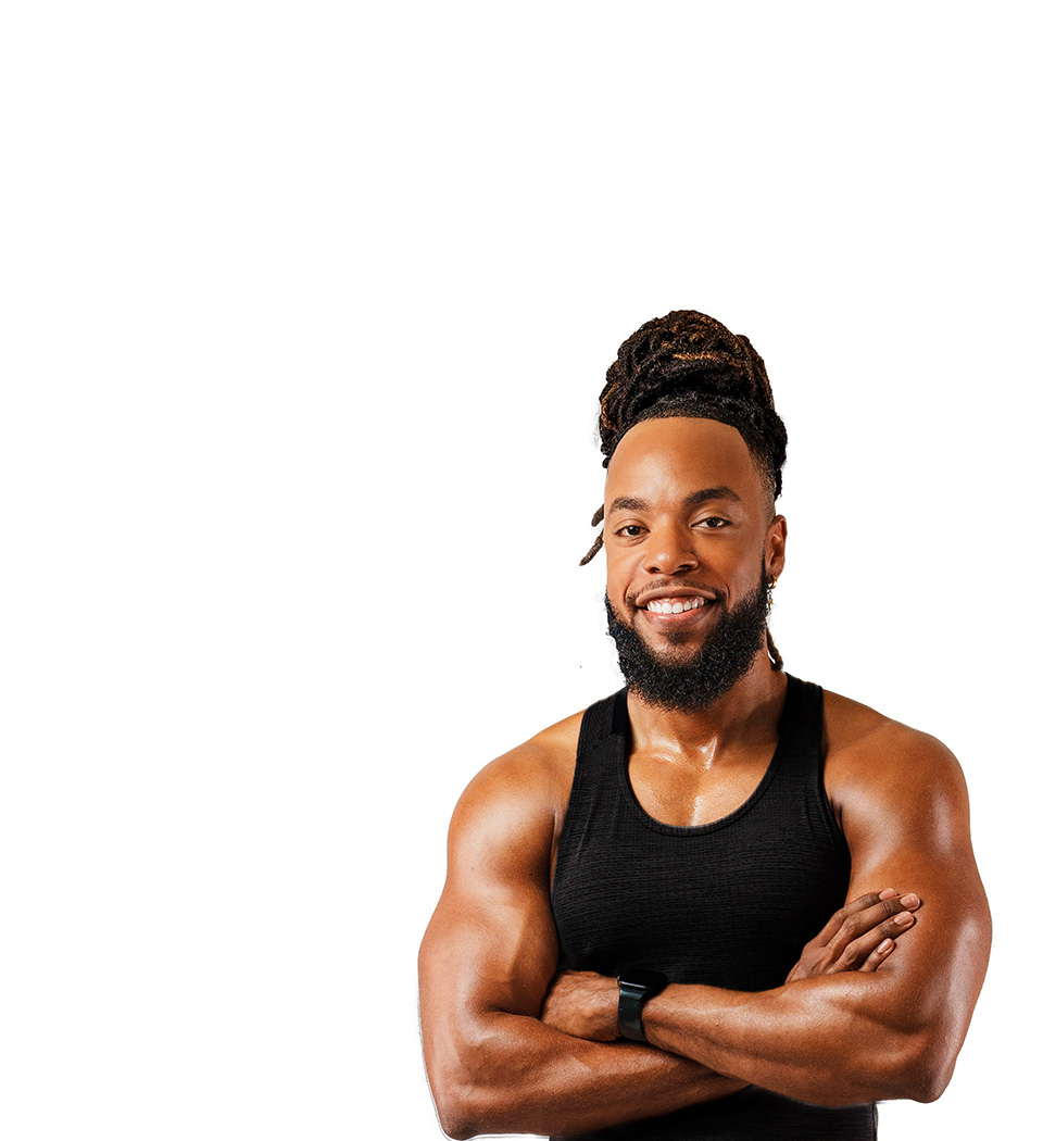 Barrys instruktör står självsäkert klädd i en svart topp mot en vit bakgrund.