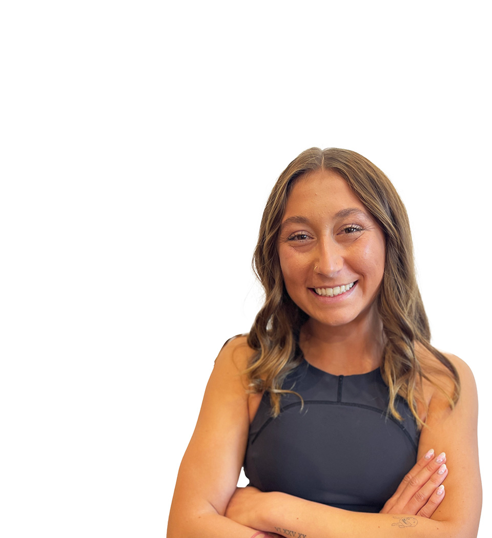 Barry's instructor standing confidently wearing a black top against a white background.