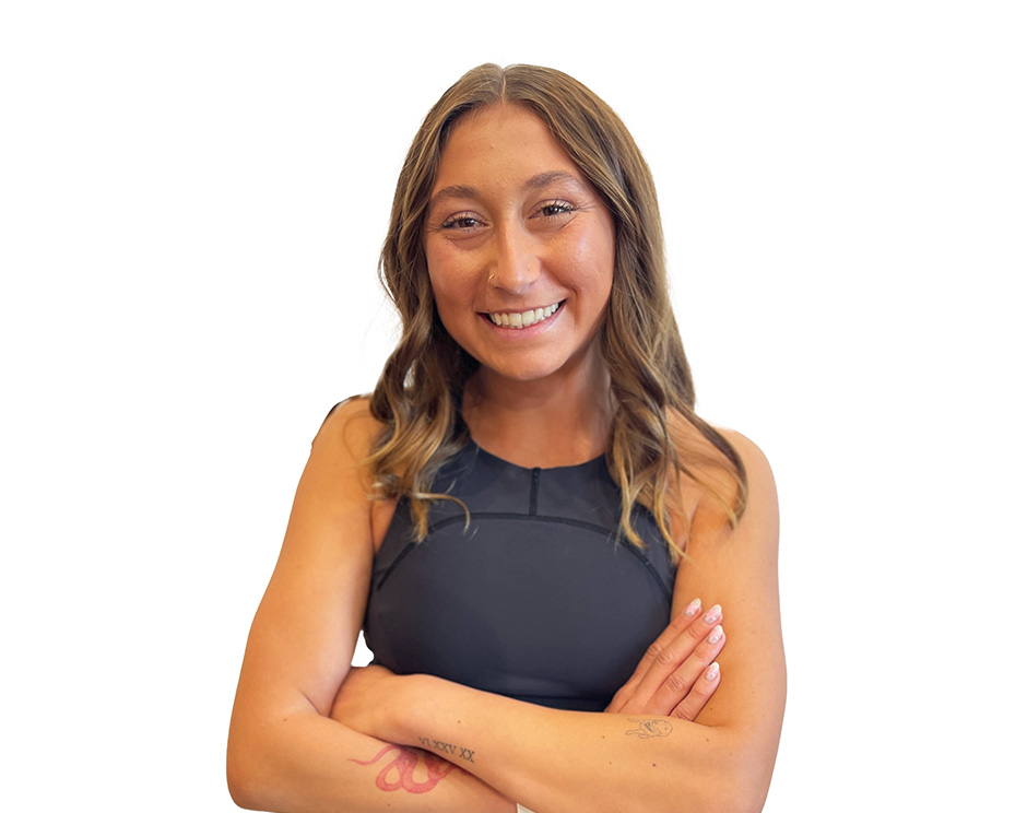 Barry's instructor standing confidently wearing a black top against a white background.