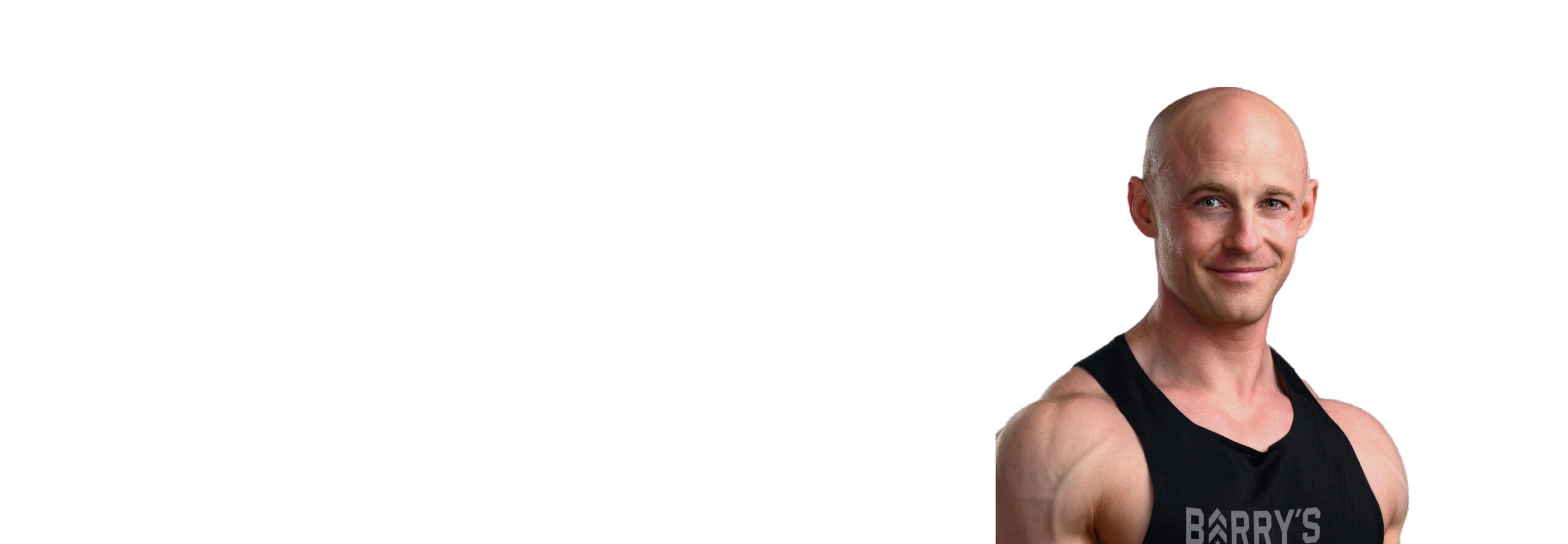 Barry's instructor standing confidently wearing a black top against a white background.