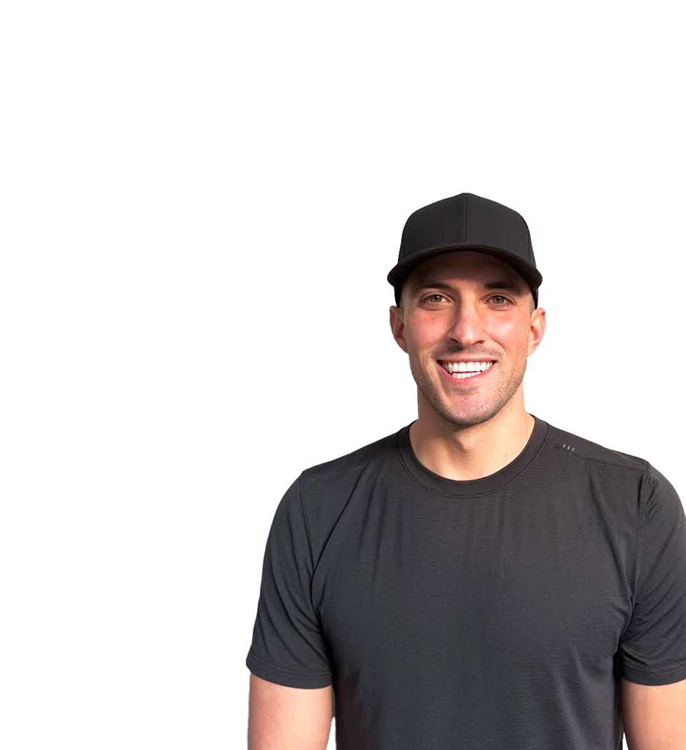 Barry's instructor standing confidently wearing a black top against a white background.