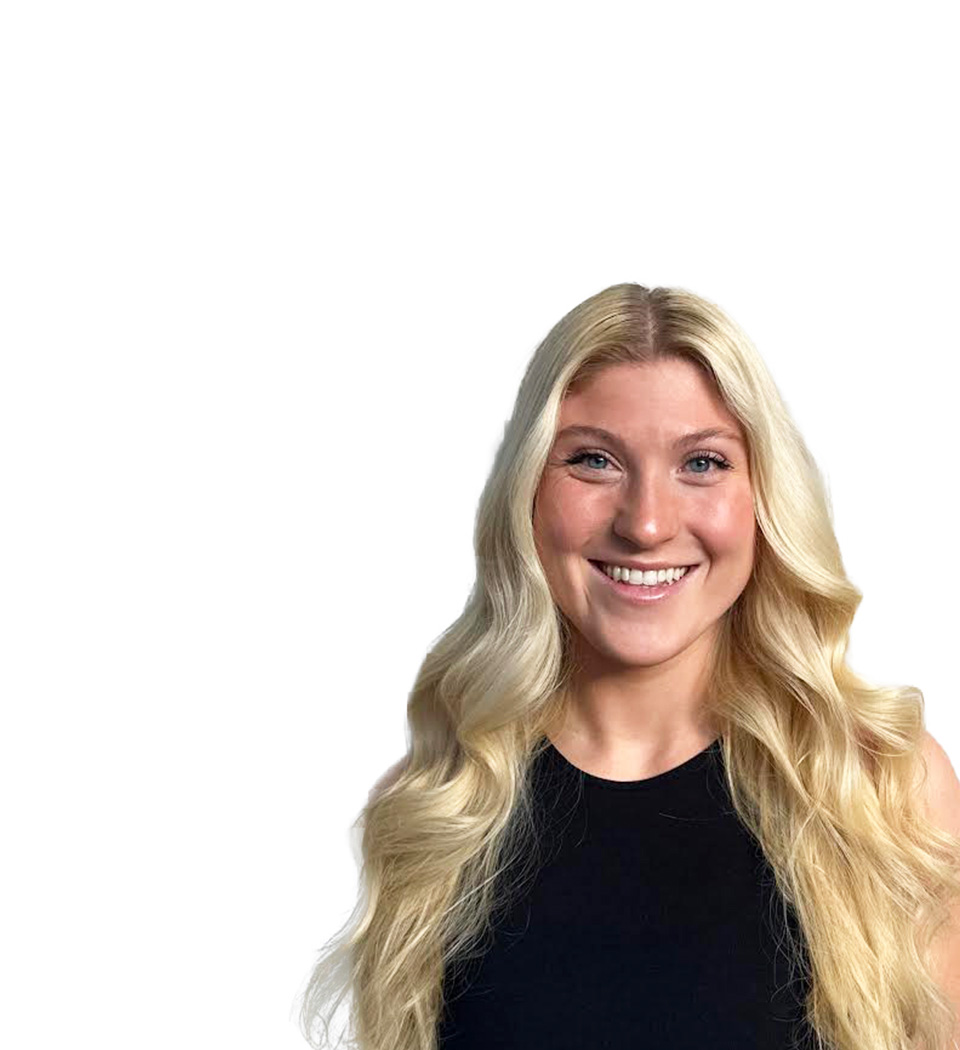 Barry's instructor standing confidently wearing a black top against a white background.