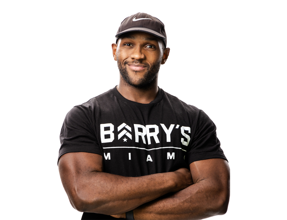 Barry's instructor standing confidently wearing a black top against a white background.