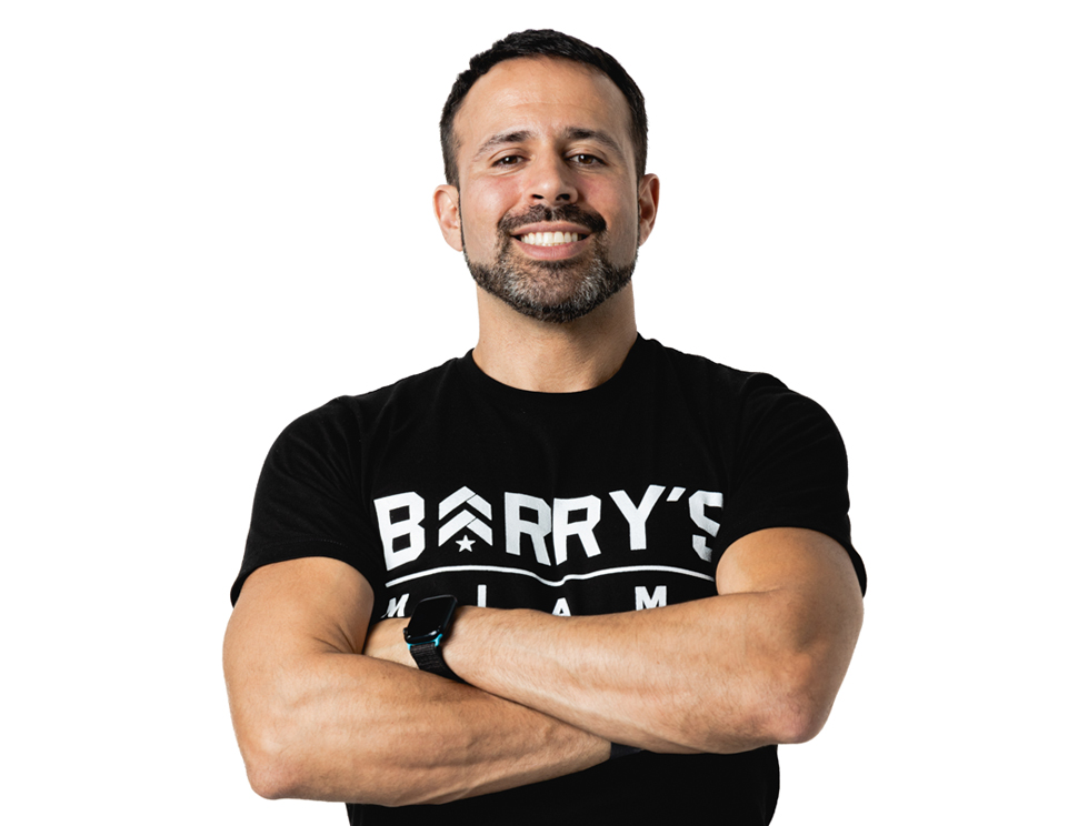 Barry's instructor standing confidently wearing a black top against a white background.