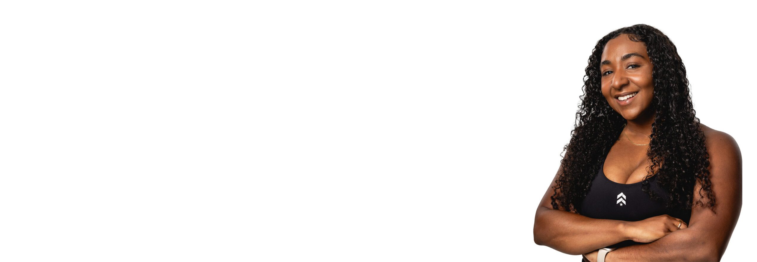 Barry's instructor standing confidently wearing a black top against a white background.