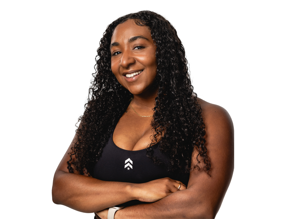 Barry's instructor standing confidently wearing a black top against a white background.