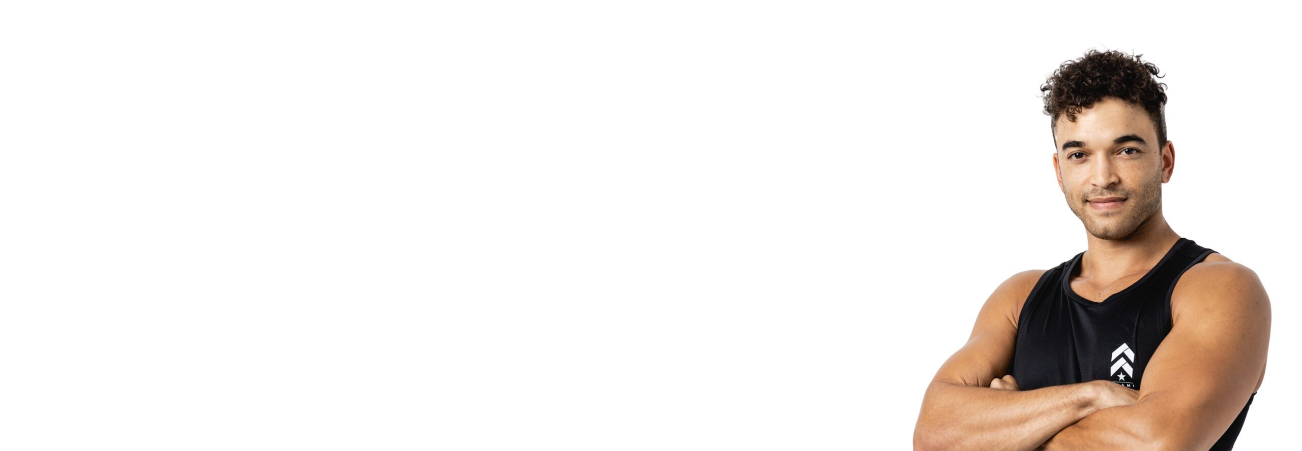 Barry's instructor standing confidently wearing a black top against a white background.