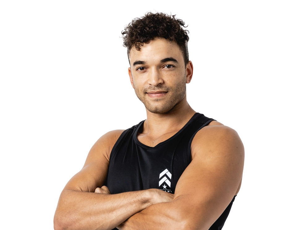 Barry's instructor standing confidently wearing a black top against a white background.