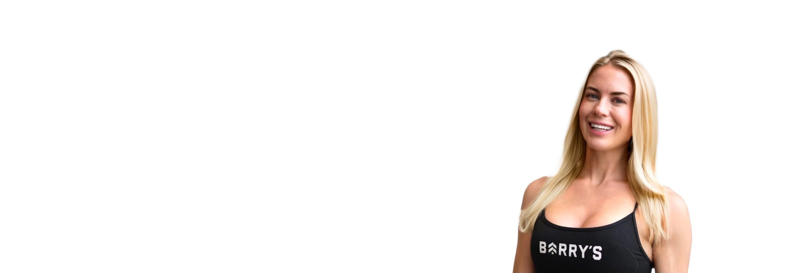 Barry's instructor standing confidently, wearing a black tank top against a white background, ready for the next workout challenge.