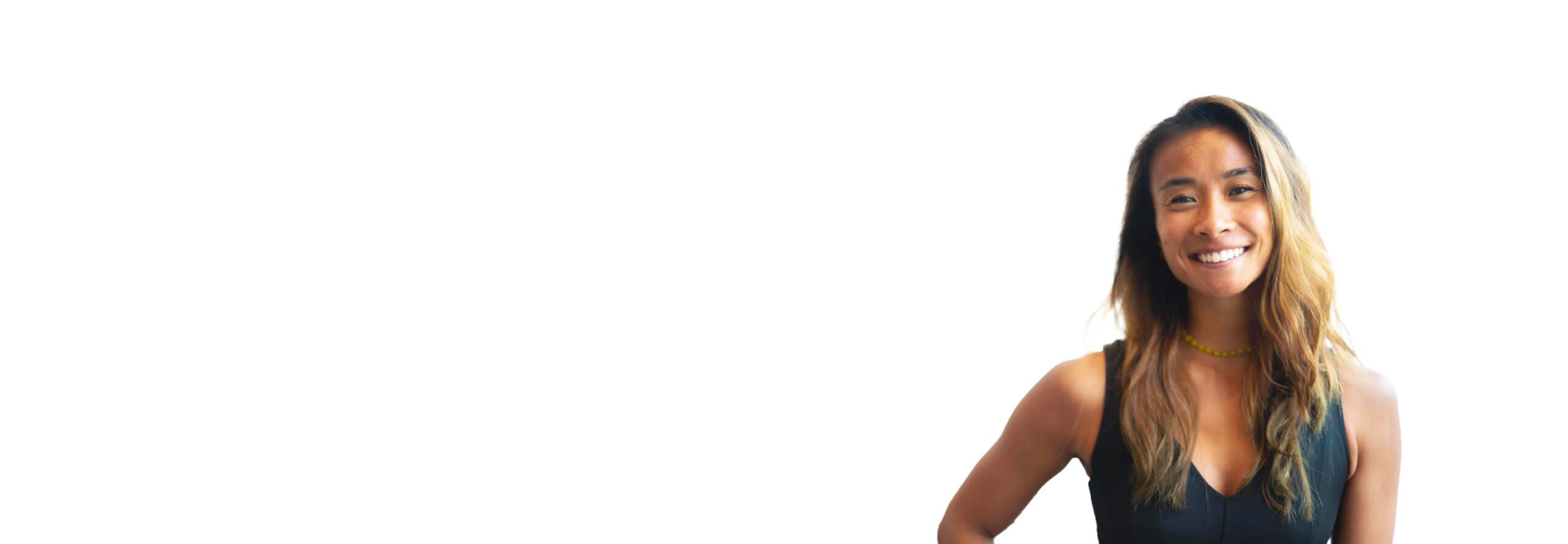 Barry's instructor standing confidently, wearing a black tank top against a white background, ready for the next workout challenge.