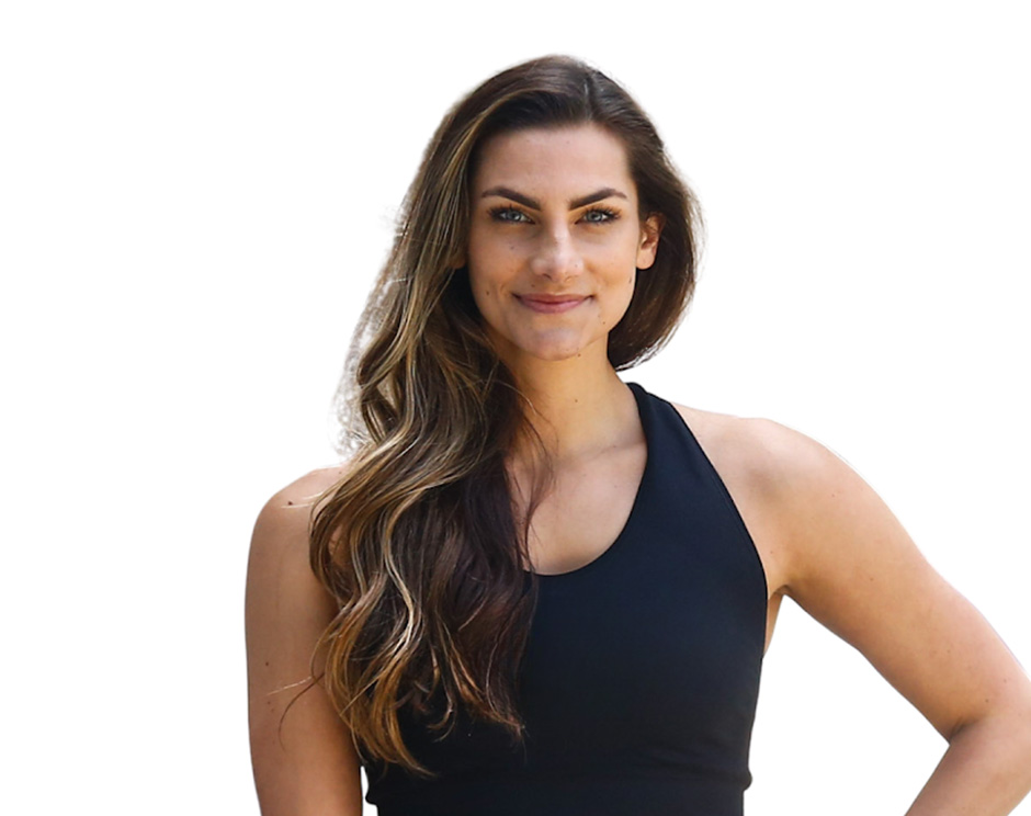 Barry's instructor standing confidently, wearing a black tank top against a white background, ready for the next workout challenge.